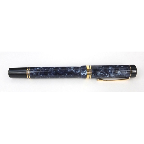 302 - Boxed Parker Sentennial blue marbleised fountain pen with 18k gold nib and accessories, the fountain... 