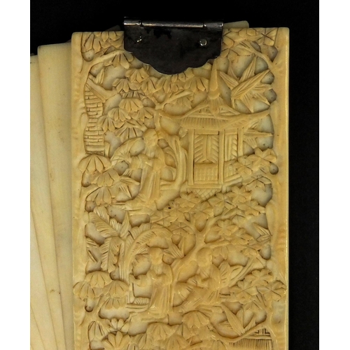 790 - Chinese Cantonese ivory aide memoire carved with figures and pagodas amongst trees with silver colou... 