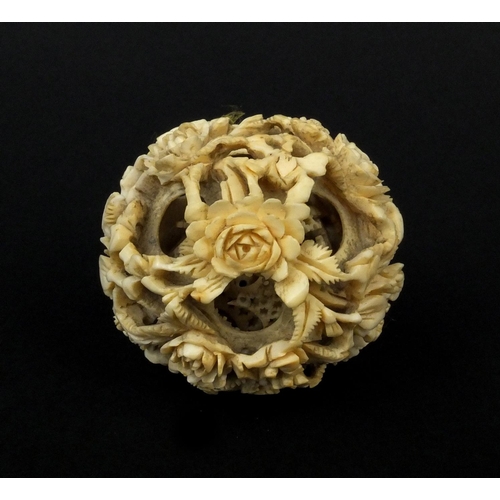 793 - Chinese Cantonese ivory layered puzzle ball carved with flowers, 5.5cm in diameter