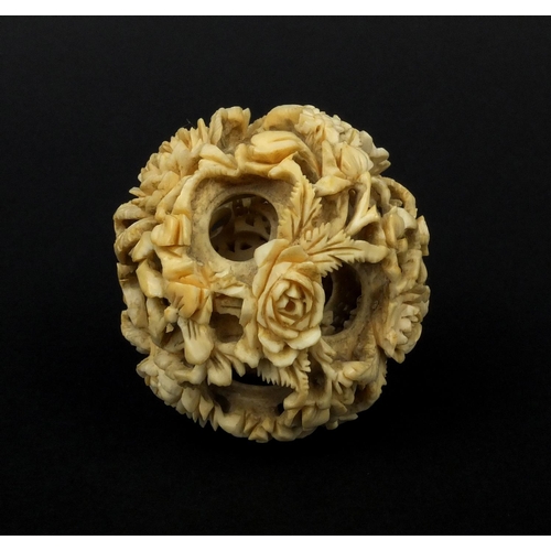 793 - Chinese Cantonese ivory layered puzzle ball carved with flowers, 5.5cm in diameter