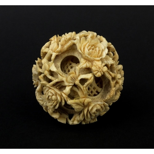 793 - Chinese Cantonese ivory layered puzzle ball carved with flowers, 5.5cm in diameter