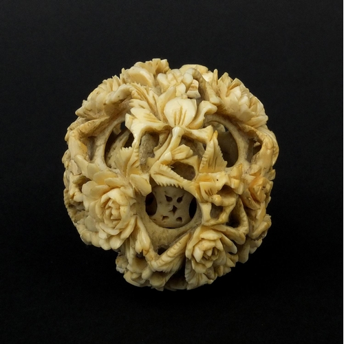 793 - Chinese Cantonese ivory layered puzzle ball carved with flowers, 5.5cm in diameter