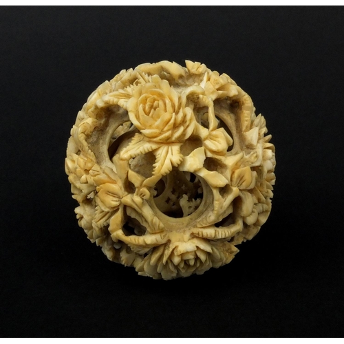 793 - Chinese Cantonese ivory layered puzzle ball carved with flowers, 5.5cm in diameter