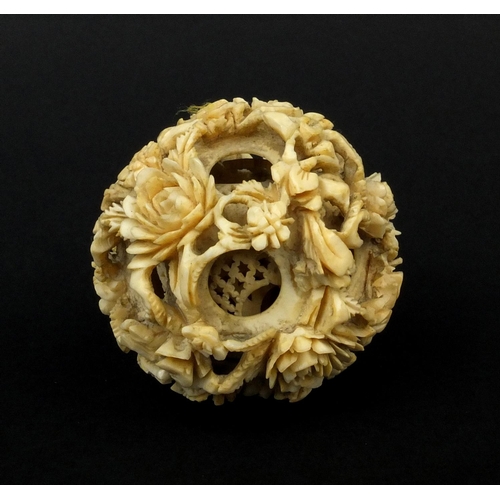 793 - Chinese Cantonese ivory layered puzzle ball carved with flowers, 5.5cm in diameter