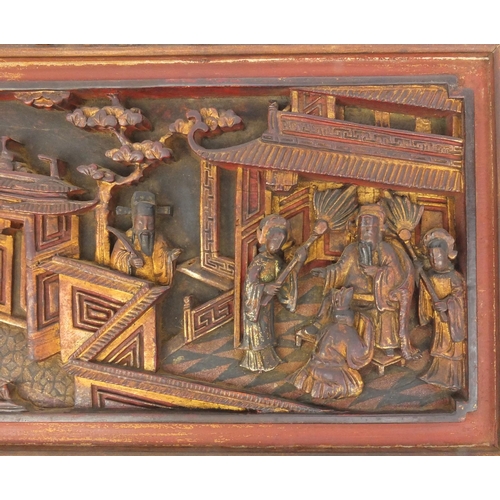 814 - Pair of Chinese wooden panels carved with figures in a palace setting, each 28cm high x 50cm wide