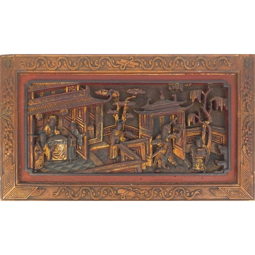 814 - Pair of Chinese wooden panels carved with figures in a palace setting, each 28cm high x 50cm wide