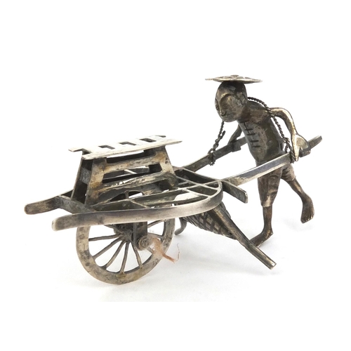 801 - Chinese silver model of a street vendor, character marks to the wheel, 8cm long, approximate weight ... 