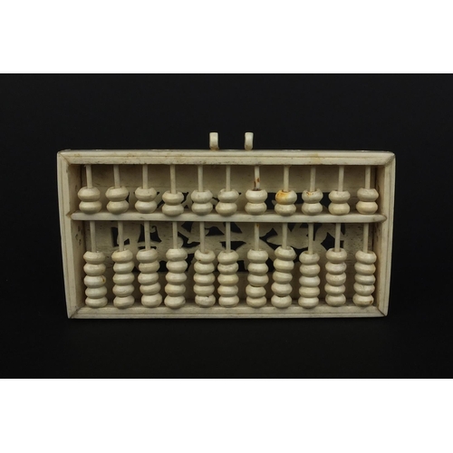 794 - Oriental bone abacus, the reverse with pierced floral panel, 10.5cm wide