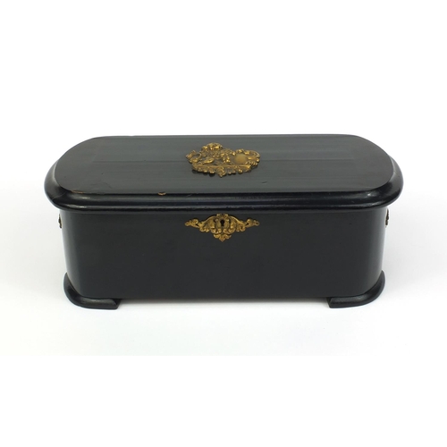 540 - Ebonised Swiss music box with gilt metal mounts, the hinged lid with applied gilt lion plaque openin... 