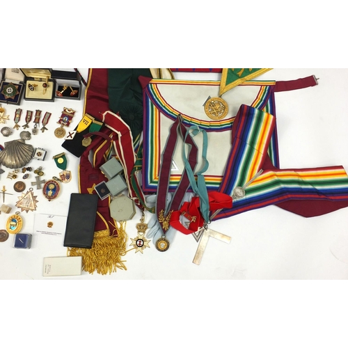 480 - Extensive collection of Masonic regalia and jewels, including a silver jewel, enamelled jewels, cloa... 