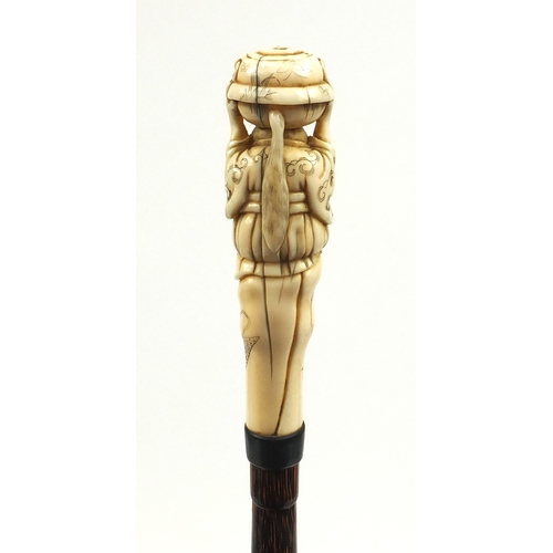 787 - Victorian silk parasol with Japanese carved ivory top in the form of a gentleman holding a twin hand... 