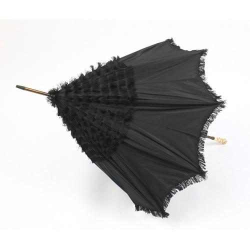 787 - Victorian silk parasol with Japanese carved ivory top in the form of a gentleman holding a twin hand... 