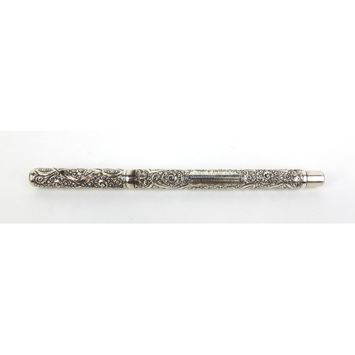 319 - Sterling silver Swan fountain pen by Mabie Todd, with embossed floral decoration, 13.5cm long