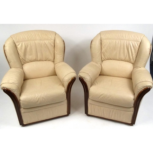 2025 - Italian cream leather three piece suite with polished wooden trim, comprising two seater settee and ... 