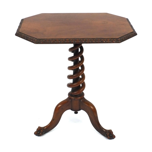 2027 - Walnut occasional table with octagonal top above a spiral twist column carved from one piece of wood... 