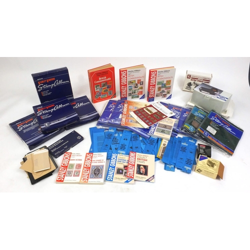 2744 - Large collection of stamp collecting accessories and reference books including The Plating of the Pe... 
