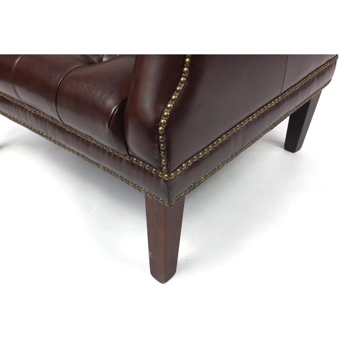 2033 - Brown leather club chair with button back upholstery, 81cm high
