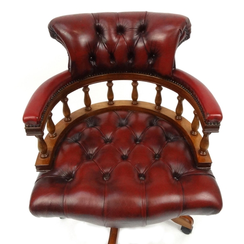 2005 - Mahogany framed red leather captains chair with button back upholstery, 89cm high