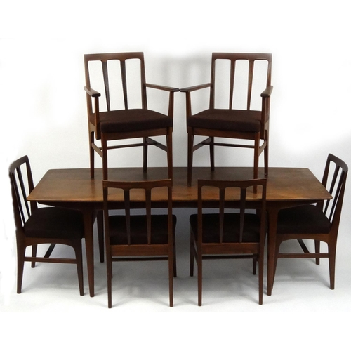 2020 - 1970's Youngers teak dining room suite comprising a table and six chairs including two carvers, a ha... 