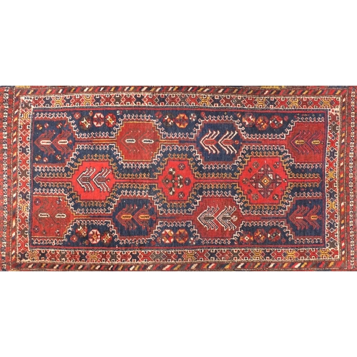 2044a - Rectangular Persian Qashqai carpet runner, the central field with Tribal gul motifs, the boarder wit... 
