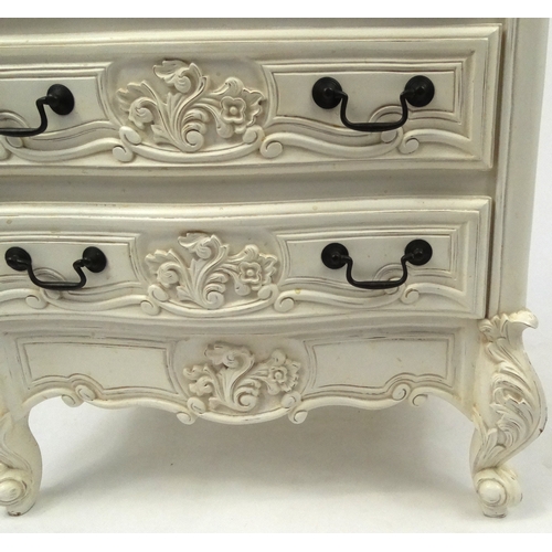 2028 - Cream serpentine fronted seven drawer chest with carved decoration , 126cm high