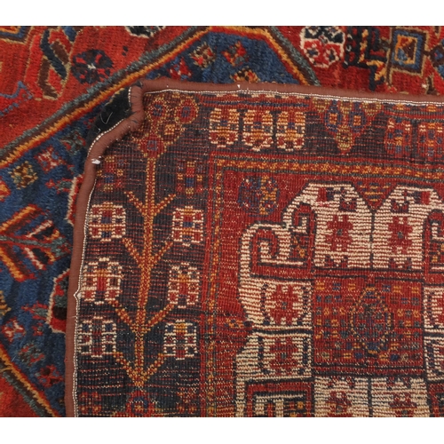 2049a - Rectangular Persian Qashqai rug, the central field and boarder with a geometric flower and tree desi... 