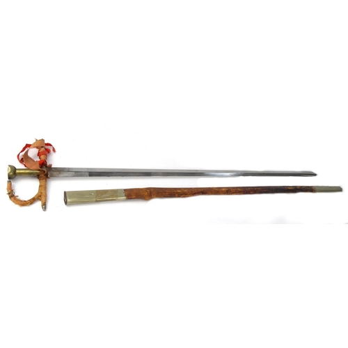 622 - Eastern dress sword with scabbard, the blade marked V.FERRANDIZ Valencia, 100cm long