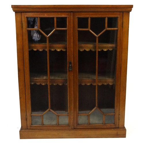 1 - Victorian oak glazed bookcase including two adjustable shelves, 104cm high x 87cm wide x 31cm deep