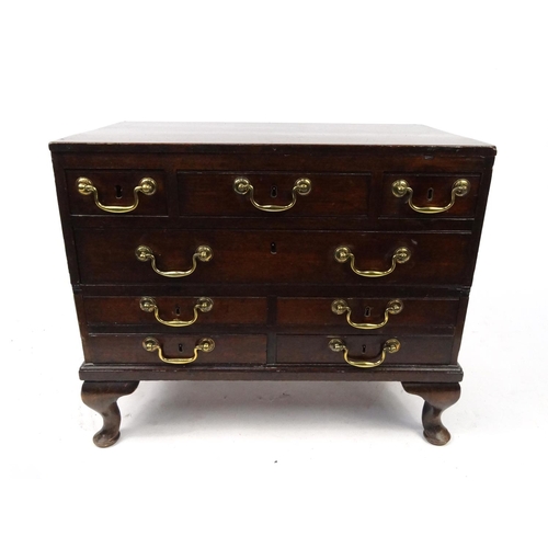 9 - Mahogany chest fitted with an arrangement of eight drawers on cabriole feet, 58cm high x 69cm wide x... 