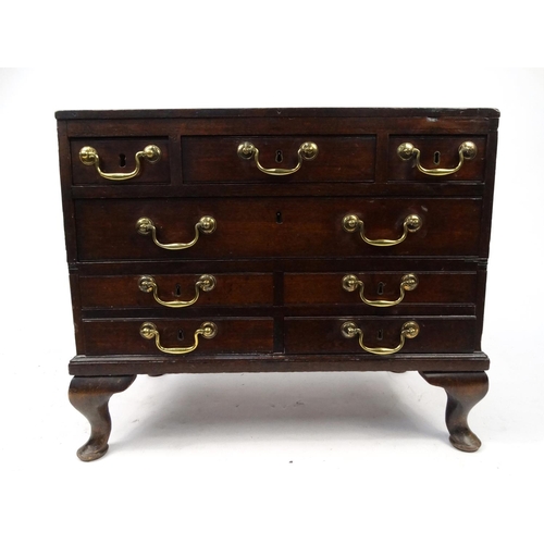9 - Mahogany chest fitted with an arrangement of eight drawers on cabriole feet, 58cm high x 69cm wide x... 