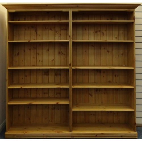 19 - Large pine bookcase fitted with ten adjustable shelves, 188cm high, 180cm wide x 25cm deep