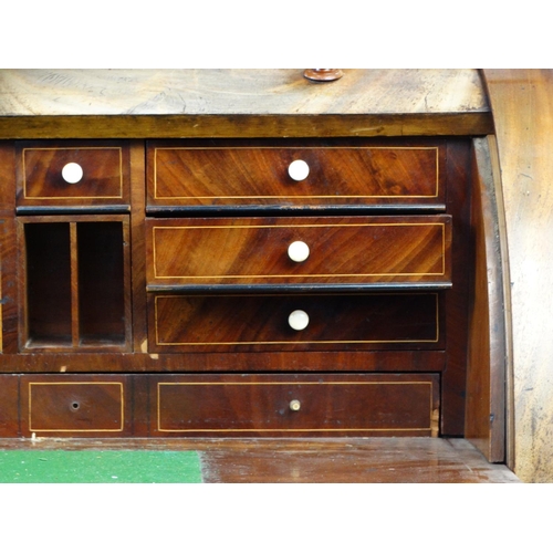 20 - Victorian mahogany cylinder bureau with pull out writing slide and an arrangement of drawers and cup... 