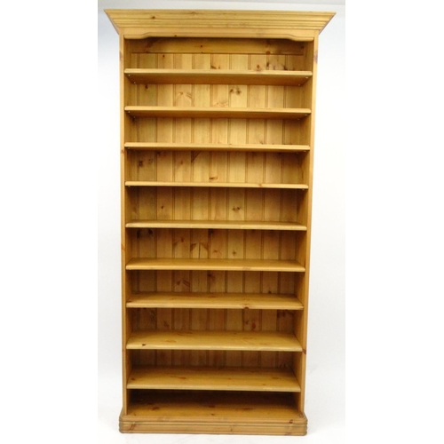 27 - Pine bookcase fitted with nine adjustable shelves, 188cm high x 96cm wide x 25cm deep