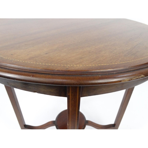 36 - Circular Edwardian inlaid mahogany table with under tier, 73cm high x 59cm in diameter