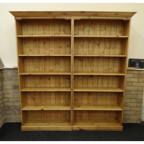 44 - Large pine bookcase fitted with ten adjustable shelves, 188cm high x 178cm wide x 25cm deep
