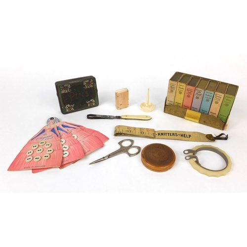 72 - Group of sewing related objects including an ivory vesta case, set of book shaped containers, button... 