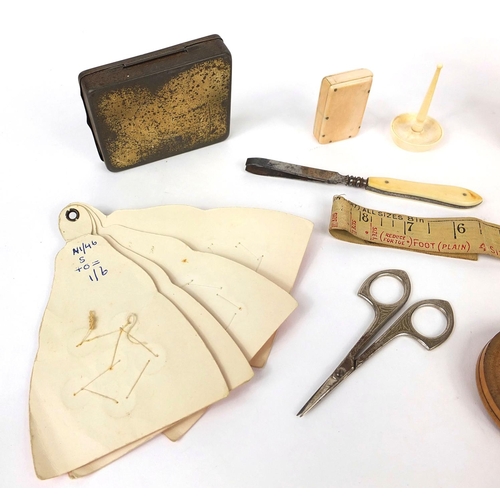 72 - Group of sewing related objects including an ivory vesta case, set of book shaped containers, button... 