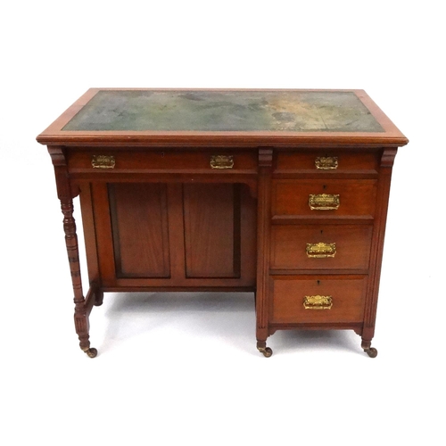 2025 - Late Victorian walnut writing table, with tooled leather top above an arrangement of five drawers an... 