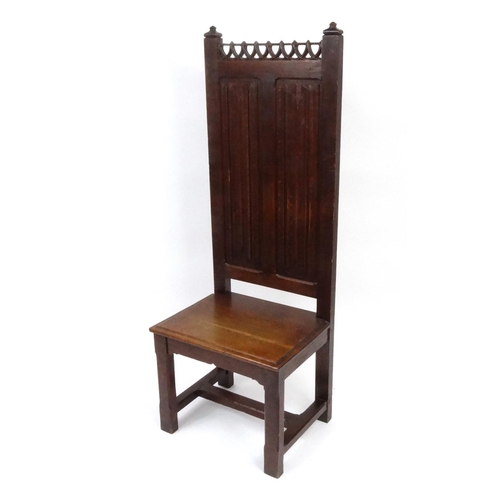 2018 - Gothic design oak hall chair with linen fold panel back, 147cm high