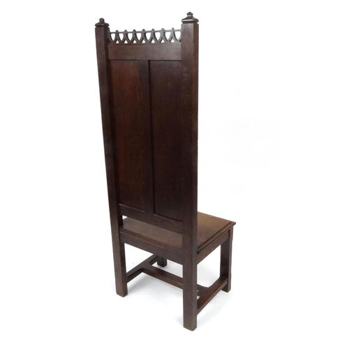 2018 - Gothic design oak hall chair with linen fold panel back, 147cm high