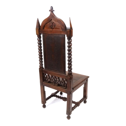 2022 - Gothic design oak hall chair with carved panel back and barley twist supports, 145cm high