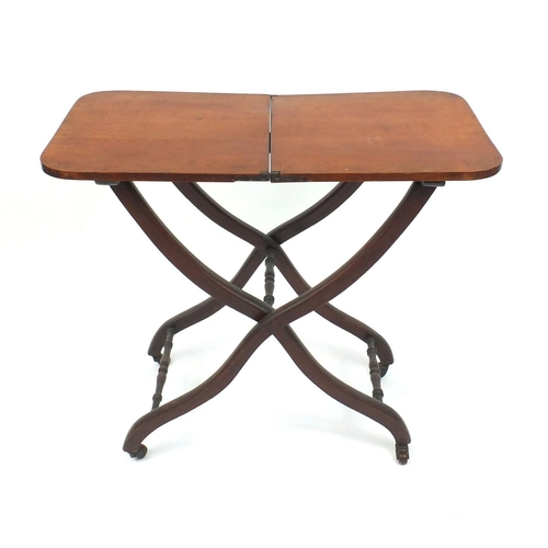 2034 - Victorian mahogany folding campaign table with X frame base, 70 cm high x 79cm wide x 40cm deep