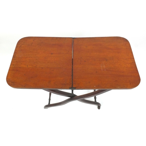 2034 - Victorian mahogany folding campaign table with X frame base, 70 cm high x 79cm wide x 40cm deep