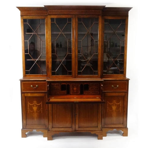 2002 - Inlaid mahogany breakfront secretaire bookcase, fitted two pairs of astragal glazed doors above an i... 