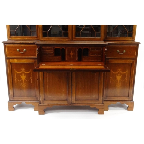 2002 - Inlaid mahogany breakfront secretaire bookcase, fitted two pairs of astragal glazed doors above an i... 