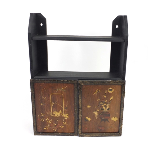 21 - Oriental Chinese wooden lacquered two door cabinet, with bird design interior panels, 55cm high x 39... 