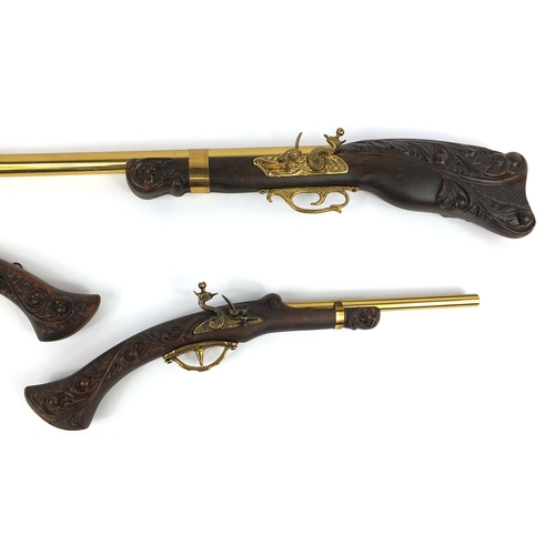 712 - Pair of decorative flint lock pistols and rifle, the rifle 105cm long