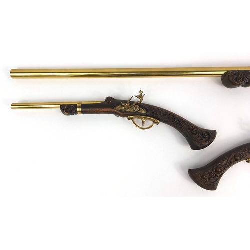 712 - Pair of decorative flint lock pistols and rifle, the rifle 105cm long