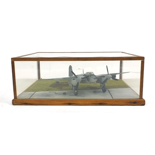 708 - Model aeroplane housed under a Perspex and wooden case, 39cm wide