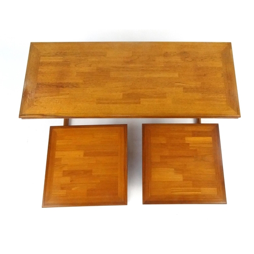 26 - Nest of three teak tables, the coffee table 45cm high x 126cm wide x 51cm deep